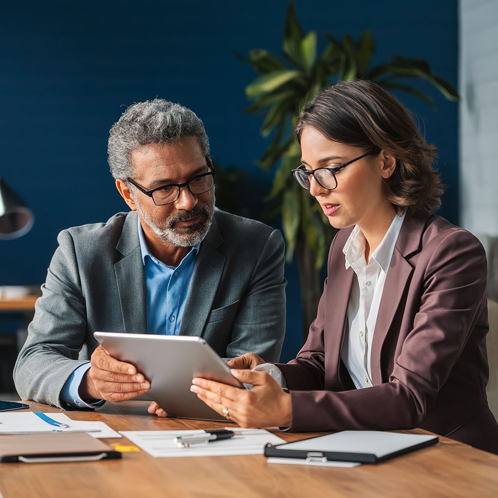 male-female-colleagues-discussing-business-plan-meeting-creative-office (1)